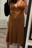 Ordered this item for my proposal dinner! I ordered my usual size and it was a tight fit, but not enough to size up. I wish it was lined as it does show everything. Did like the dress and it was my top contender for a while, but it needed some alterations to bring the bust up for it to be flattering, and the color isn't as rich as the pictures. Ultimately went with another dress but still keeping for a future event! Pic includes the alterations! - Kaitlyn A.