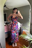 Beautiful dress! Runs small! I usually wear a small and had to return for a medium. The dress is very fitted around the rib cage. I'm large-chested and it fit my boobs just tight at the rib cage. Also with sizing up it's more of a maxi than a midi on me but I like the length. - Erin L.