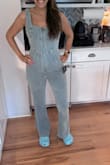 Love this jumpsuit. I wish there was a similar one with sleeves too. Comfortable and flattering, which is a hard combo to find in denim. Perfect length and I'm 5'5. I am a small on the top and a medium on the bottom, and the small fits well. Fitted but not too tightly, so if you are in between sizes, I'd size down. Highly recommend! - Marline K.