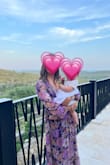 I picked this dress because it was a true wrap dress, thinking I'd easily be able to breastfeed my baby while at a wedding. It wasn't easy to feed her, but it wasn't impossible. I also chose it because of the fabric which fell nicely on my body and hid my midsection. I'm six months postpartum and still have a belly I'd like to hide. I felt sexy because of the v-neck and elegant because of the length of the sleeves and dress. - Victoria M.