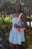 Material is quality, embroidery detailed. I loved most the bow at the back of the dress. - Latoya E.
