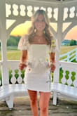 I bought this for my daughter to wear to her National Honor Society induction awards banquet. It looked beautiful on her. However, she is small and busted so it ran big at the top. Exchanged small for extra small.  She wrapped the bow around and tied it in the front, it looked beautiful that way. Also looks great tied in the back.  I love this dress.  It is much prettier in person than in the pictures. - Rayann H.