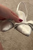 The shoe hangs off my foot and has black marks all over it. - Alexis W.