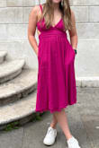 This dress is so comfortable and secure. I was worried about lipping because I don't always stand straight. And nothing! The material is super comfortable and breathable. The adjustable straps and tie waist in the back is perfect to fit snug. - Megan M.