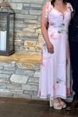 I found myself in a last minute dress emergency. I had this overnighted and it fit perfectly. The plunging neckline was a bit much for my age, so I used a little fabric to fill in the space. Very happy with this purchase and I got a lot of compliments. - Terri H.