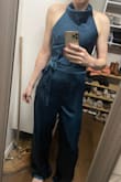 This is my first time buying jumpsuits. It looks very nice but I'm not sure I'm sold on the jumpsuit style (my own personal preference, not the jumpsuit's fault). I ordered some belts to see if I like the look better if it's broken up a little more. I love the open back of this one. The cowl neck is a little odd because of how small it is. I bought this and another one to potentially wear to a wedding and haven't decided which to wear yet. - Hannah A.