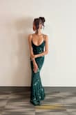 I recently wore the forest green prom dress from Lulu, and I couldn't be happier with my choice. The dress was absolutely stunning and fit me perfectly. The rich forest green color was both elegant and unique, making me stand out beautifully at prom. The quality of the dress was impressive, with fine stitching and a luxurious feel to the fabric. It was comfortable to wear all night long, allowing me to dance and enjoy myself without any issues. I received countless compliments throughout the evening, which made me feel even more special. Overall, I highly recommend this dress for any formal event. It's a show-stopper that combines elegance, comfort, and style flawlessly. - Danielle C.