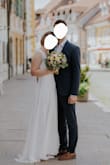 We had a small wedding ceremony and this dress was perfect! Simple, classic, elegant, comfy, flowy and very much me. I did have it a bit tailored - narrowed in the bust (but only for a few cm, just to make it look cleaner) and shortened in the front. If you're tall or wear very high heels you might be happy with the original length. The material is nice, easy to wash, iron and tailor, only the ribbons at the shoulder are made from a material that's a bit itchy - but I forgot about it soon. Def recommend! - Eva M.