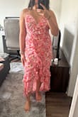 Beautiful dress with a nice design but the top is a little loose on me. Overall it fits really well. I am usually a large and that is the size I got. A little stretchy but not too much. - Shefali V.