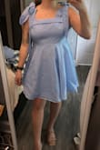 I knew this dress would run small as the bust line did not stretch. I'm typically a M/L and even the large was too tight. I could not zip up the dress at all. It also felt a bit short and the bows on the straps a tad long for me. The blue is giving Dorothy but still cute nonetheless. - Amy A.