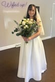 So a little backstory, I fell in love with a 700 dollar dress from David's Bridal, but decided I couldn't possibly spend that much on a dress I'd wear once. I was suggested Lulu's from a few people and I'm so thankful I ordered this dress! I did size up to a large after reading the reviews, and I agree that the waist would've been too tight if I ordered a medium. I did get the dress altered to fit my shoulders and the length of the dress, and she added a mesh insert on the bust.  I used a coupon so the dress was less than $100, which is such a steal for how perfect it is! It's classic, flattering, and simple, which is exactly what I wanted. The dress was comfortable, and I liked that it was a nice cut on my chest. I used a sticky backless push-up bra, which I had no problem finding and it stayed all day. Overall, really happy I purchased this dress, and it helped me stay within my budget! It was photographed so well. I would highly recommend getting your wedding dress from here. Thank you Lulu's!!! - Bailey S.