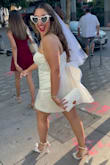 I first ordered a Large, but was too small, so I was hesitant to order the same dress in a different size. I normally wear size 12/14. After looking everywhere, I went for it, and it was the perfect dress for my bachelorette party. It was a tiny bit large in the bust, but boob tape fixed that issue. The bow was absolutely iconic, the dress fabric is great quality, and the overall feel very flattering. I cannot recommend enough. - Andrea D.