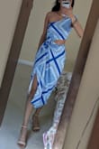 The dress is beautiful, comfortable, and high quality! Great value for the price. There's a liner inside and a zipper/clasp on the side. I bought an XS, and I am keeping this size. However, my shoulders and torso are very narrow, so I have to tie the top pretty tightly to fit securely. I can still wear a strapless bra if I choose. If I had bought an XXS, I would not have been able to get the zipper all the way up. You can tie both the top and bottom to fit your body, so it's pretty adjustable. For someone with a larger bust, I can see how the sizing might run small or the dress may be too sexy for a wedding guest. For myself, I feel like it's great and still appropriate for a wedding with a cocktail dress code or something (though it obviously leans a bit beachy). I got many compliments. - Tanvi M.