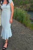 This dress was absolutely beautiful - I got so many compliments on it. I'm a bit short so I ordered an XS first, then exchanged it for a size Small which was perfect. I originally wore it for my graduation and then again a week later to a wedding - I was only sitting at the wedding, and I got a rip in the back of my dress right along the lower back. I think the outer material is just a little delicate, so that may be why. I will try to fix it, because otherwise, it is really gorgeous!! - Michelle H.