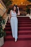 I got the set in white; top in small and pants in medium. This is so absolutely beautiful and soft. I felt so great wearing it. I bought it for my job in Miami. But wore it out to dinner in DC in the pictures. Looks great with a blazer for work but so sexy for a girls' night dinner outfit. Just obsessed. The pants are so long and definitely need heels, which I love. - Amalia F.