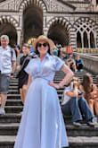I wore this dress to our honeymoon in Italy. The material is nice quality, but still not too thick for a hot for a summer day. The color and cut is very flattering. Highly recommend! - Samantha W.