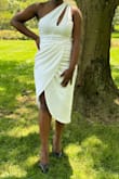 The fit was a little tight but not uncomfortable. Someone else would have considered it true to size. The fabric was weighted but breathable and had a silky lining to smooth it out. The split wasn't too high and was easy to walk in. - Fatima A.