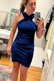 This dress is really nice. The material is solid, it's not cheap or see-through by any means. I read reviews complaining about the neck line choking you but it didn't seem to bother me at all. I'm always stuck between sizes (small and medium). I got a medium and although it fits me great, I think I could have gotten away with the small. There is a little extra fabric in the mid section on me that doesn't hug my body quite right. Had I gotten the small it probably would have fit perfectly and really accentuated the hour glass shape, but I'm going to keep the medium because it still fits really nicely on me and I just don't feel like returning it over something so minor. The length is perfect too imo. Very appropriate for a wedding, not too short and not sitting at my knees where it'll make me look stumpy. Hope this helps! - Lily O.