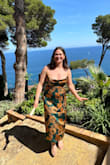 Wore this for a destination wedding and it was great!! I'd say it fits true to size. Tightened the straps a bit more after the pictures, but it was a great length, tight but not uncomfortable. Had some trouble getting the top to lay flat, but with some ironing, it would have been fine. - Phoebe A.