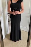 This dress took a little while to come. At first, they shipped the wrong dress and provided a refund then they were out of stock. I am thankful I persisted. The dress arrived I tried it on I can't wait to wear it. I love that the neckline is high enough to hide cleavage but still fancy. It has some stretch it's nice lined fabric. Going to wear this with 2.5 inch heels. - Ruby V.