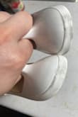 Great shoe, cute little thing, runs small for people with wider feet. I noticed on the back of both heels were black scuff marks, and there's a little scuff on the toe, not sure why? Maybe they were used and returned? - Jessica D.