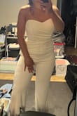 I originally bought this romper for my bridal shower (not really a dress type of person). It fit well and true to size. The front ended up being a little too plain for what I was looking for (I knew I would be taking lot of pictures from the front) but the back of it was super cute! - Mikayla L.
