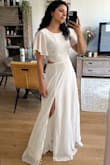 It is like in the pictures. The fabric is really good. The skirt flies flawlessly. The color of the dress is a beautiful tone of white. - Luisa C.