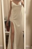 The fabric on the dress is beautiful and the bottom part falls amazingly. It was too long for me on the front and it has a small train. The neckline is a little tricky since the fabric is loose so I recommend paying attention to that. It did not fit my body type but it is a master piece for the right body. The back is gorgeous althiugh it feels a little tight on the last end of the zipper. - Arenski V.