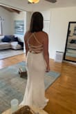 I loved this dress! The back is so fun and the whole dress is comfortable and lightweight. I just found another one that I liked better. I'm usually a medium, and this fits great in the large. - April N.