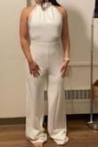 I liked the fit, but I wished the waistline was higher so that it would make my long torso appear shorter. Material is thicker and better quality than some other white Lulus jumpsuits/dresses - Dawn L.