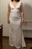 I wanted to get this dress for my wedding, but the material looked cheap in person and the ribbons made my neck appear shorter. Wasn't the most flattering on me sadly although it looked so elegant on the model :( - Dawn L.