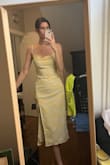 I am in love with this dress! It fits so perfectly and accents curves. I originally bought to wear to a wedding because it is a pale yellow but in natural sunlight looks a little more white with yellow so decided not to, but I loved it so much I kept for a different event (: - Sami T.
