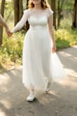 Other reviews reported that the arm straps are a bit too tight, I did not personally have said issue. The dress fit pretty true to size otherwise. - Jess M.