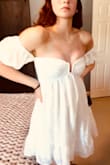 It was a beautiful fit (size small). I wore the sleeves off the shoulder as well as up on the shoulder and both ways looked lovely. - Jessica J.