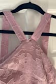 The fabric is pretty and the dress fit well but I returned it because it was made improperly. The top hem of the neckline was incorrectly lined up and stitched together. It was visibly not the same as pictured. - Carrie G.