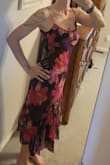 Beautiful midi. Figure flattering. Not much stretch though, so be careful. Sexy, but classy. I plan to wear to an upcoming summer event. - Page D.