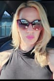 Very flattering!!! So many compliments on such a simple tank. I wore a racerback bra so you wouldn't see the straps at all. I also have this in pink! - Page D.