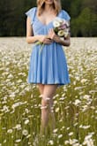 This dress was super cute for my senior pics; the color looked great with the sky and flower field. - Rachael B.