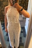 I am wearing this for my rehearsal dinner in a couple weeks. It's super cute and the lace is beautiful! It's quite long, but will work for what I need. I'm 5'7 and I'm going to wear some high platform heels (3-4 inches) in order for the lace to not drag. I can make do without getting it hemmed but beware it is long! - Hailey G.
