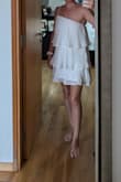 Bought this for pre-wedding photoshoot and wanted something short and fun, to complément my more formal dress. Originally bought a medium but sized down and it's perfect. Thick lining so not see through. - Elise R.