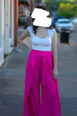 I love these pants! They are so fun and flattering! They are a little long on me so I would recommend wearing taller heels if you are shorter like me :) I also don't really have very big hips. It was a little difficult for me to put them on, and the slits in the sides are a little high so be careful when sitting or if it is windy out. The fabric is very smooth and comfortable. The pants are also not see-through, although they will show lines a little at certain angles. I would definitely recommend these pants and have gotten so many compliments on them! - Maria K.