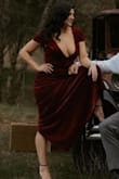 This dress adds a sexy twist to a classy and classic design with a plunging neckline. The neckline is the perfect statement and makes it a show-stopper. The fit is true to size, and the color is true to the photos. The dress fits comfortably. People rave about the dress in our engagement photoshoot. - Lea V.
