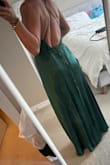 Excellent purchase.
The fabric is silky, and not cheap at all!! The quality of the fabric is excellent and it flows beautifully. Dark emerald green as on the website. If your style is simple and classy then I recommend it.
Fits perfectly. Bit confusing at the beginning with the ropes but can be figured out. 
I love it!! - Mona B.