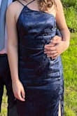 I originally ordered this in size Small (I am usually between sizes)- it was slightly snug and unflattering so I sized up to a Medium. The medium for some reason seemed to have a longer torso but adjusting the straps helped. I had to keep adjusting the top to keep it perfectly in place. Overall I did love the dress though it looks very nice and I got many compliments. This will be my go to wedding guest dress now. - Devon C.