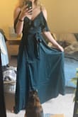 I got this because it was on clearance for a crazy good price. I LOVE wrap dresses like this so much because you can adjust them to fit perfectly. The snap thing where the bodice crosses over is absolutely useless like other reviewers said so you'll need to either take that off and wear it open (more revealing) or something more secure like a safety pin instead. It is fastened in the photos, but as soon as I'd move, it would pop open immediately. I'm 5'9" without shoes, and it's just brushing the floor. I'm usually not a fan of cold shoulder, but this one works I think. And you could actually put the shoulder part under your arm if you wanted to make it just look like a ruffle that goes all the way around the top. - Emily F.