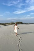 I LOVE this dress! I wore it for my beach elopement, and it was perfect! Fits very comfortably and tts. I was so happy with it. It's simple but elegant with the embroidery detail at the bottom and a tie in the back. One of my favorite dresses ever! - Nina S.