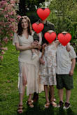 I ordered this dress for a family photo shoot and overall loved the dress. It has pretty lines and photographs beautifully. I ordered a small. The fit was good with the exception of the top fitting on the loose side. By no means do I have "Large" breasts, but I'm also breastfeeding so they're not small either. The plus side of that was being able to BF in the dress! The slit was a bit high, but I didn't mind. - Wilnelia N.