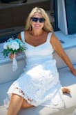 I love this dress! The lace is true quality and did not wrinkle at all, even when our wedding day started with rain. It had enough weight to not worry about a breeze blowing it too high, but was light enough to be comfortable all day in a sailboat. The fit is very figure flattering. - Audrey O.