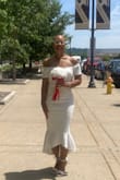 From the moment I put this dress on, I was in love with it! It hugged my arms, bust, waist, hips, and legs, perfectly! The material is firm with some stretchy give. I felt like a bride that was floating on cloud 9. I received a ton of compliments! - Yvette S.