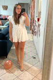 I LOVED this romper! It fit so well and I got so many compliments. The v dip in the chest is low but you still feel very secure! - Abbey S.